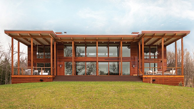 The dramatic large overhangs on the south wall facing the pond shield the home from unwanted summer solar gain, while the walls of glass provide passive solar heating in winter. Lindal’s signature Western Red Cedar siding complements the desi
