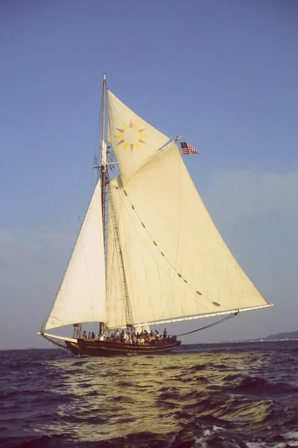 43c1bbad_sloop_blue_sky_vertical.webp