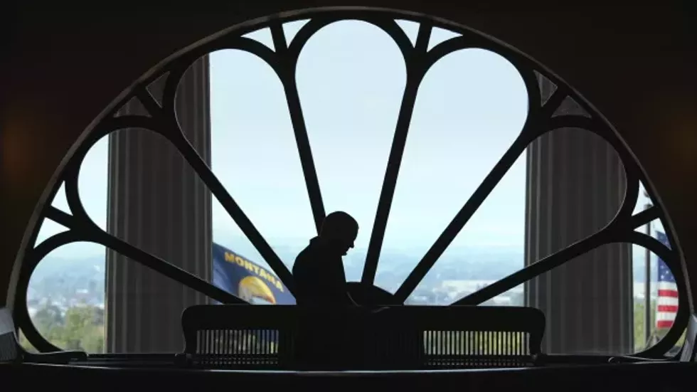 _1_-_john_s_adams_silhouetted_in_the_montana_capitol_buildin.webp