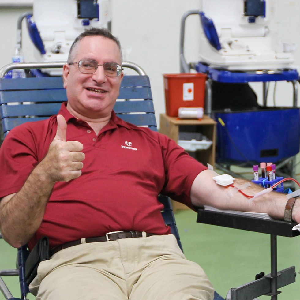 Bruce Gillman, Vassar College head fencing coach, gives blood at the team’s 2019 drive. Photo: Bennett Fort