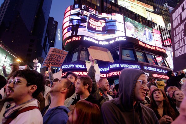 ABC News ticker informs protesters at Times Square in New York City on Saturday, October 15, 2011 that the Occupy movement has gone global.