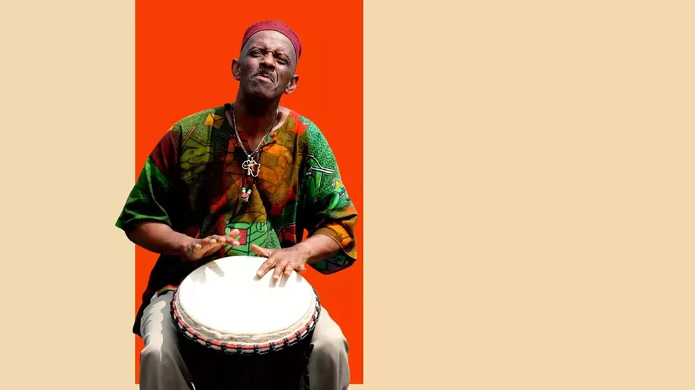 BabaKazi playing African Drum
