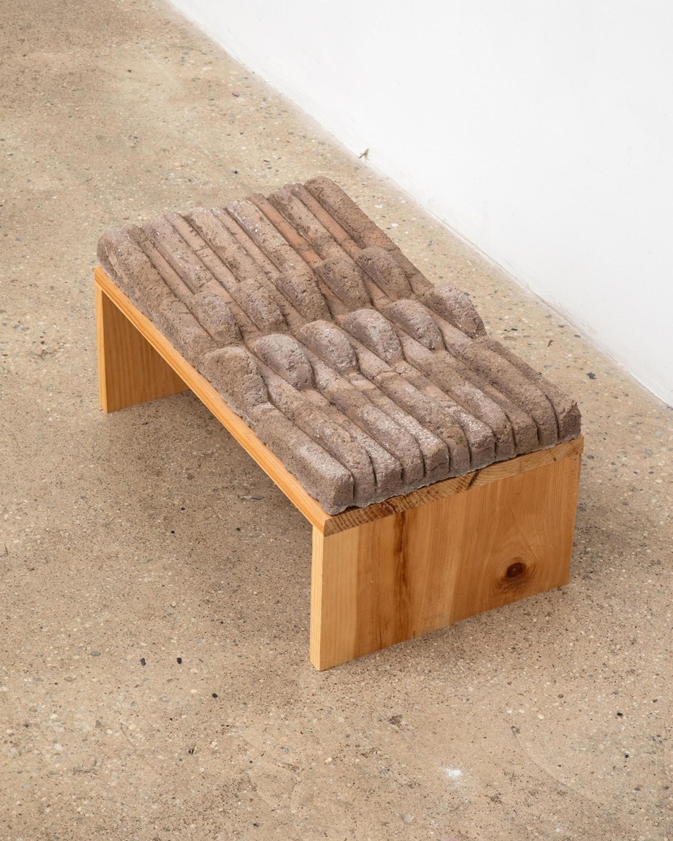 "Touch Earth," Amanda Martínez, cast adobe brick (earth, straw, sand, water), found lumber pedestal. 10 x 20 x 11.25 inches, 2022.. Courtesy of the artist.