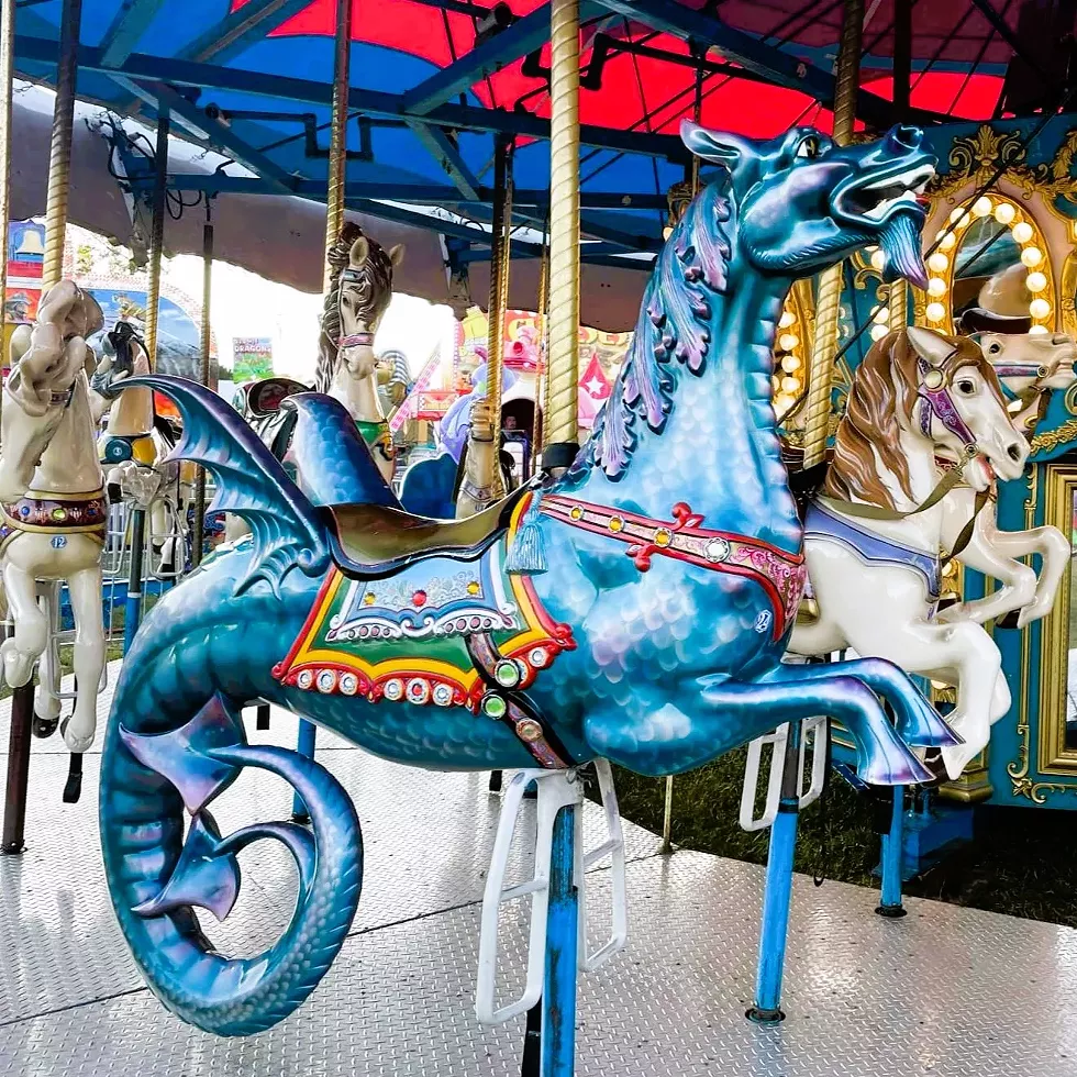 The carnival midway includes rides for the whole family.