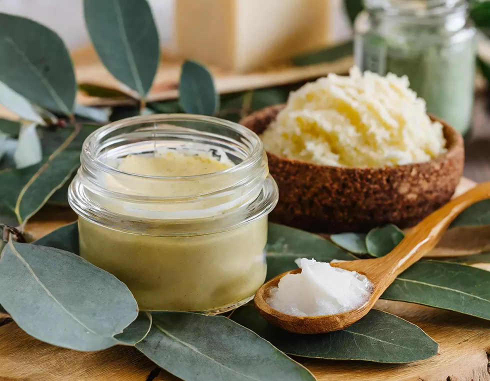 firefly_homemade_white_body_butter_in_a_glass_jar_and_body_scrub_on_eucalyptus_leaves__workshop_of_m__3_.webp