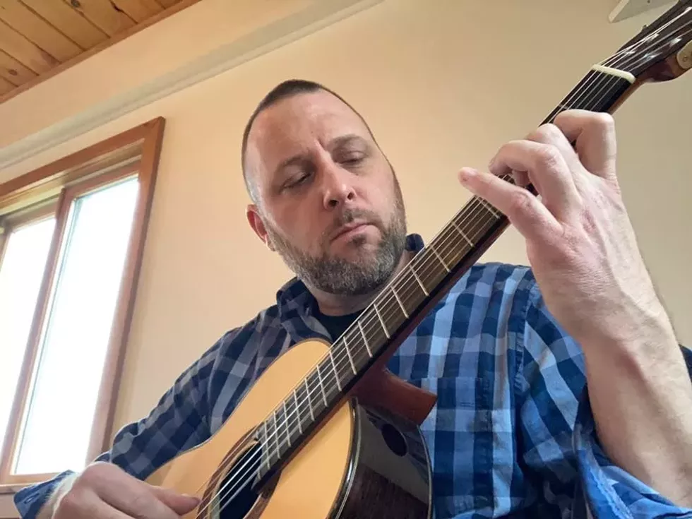 dan_stevens_closeup_strumming.webp