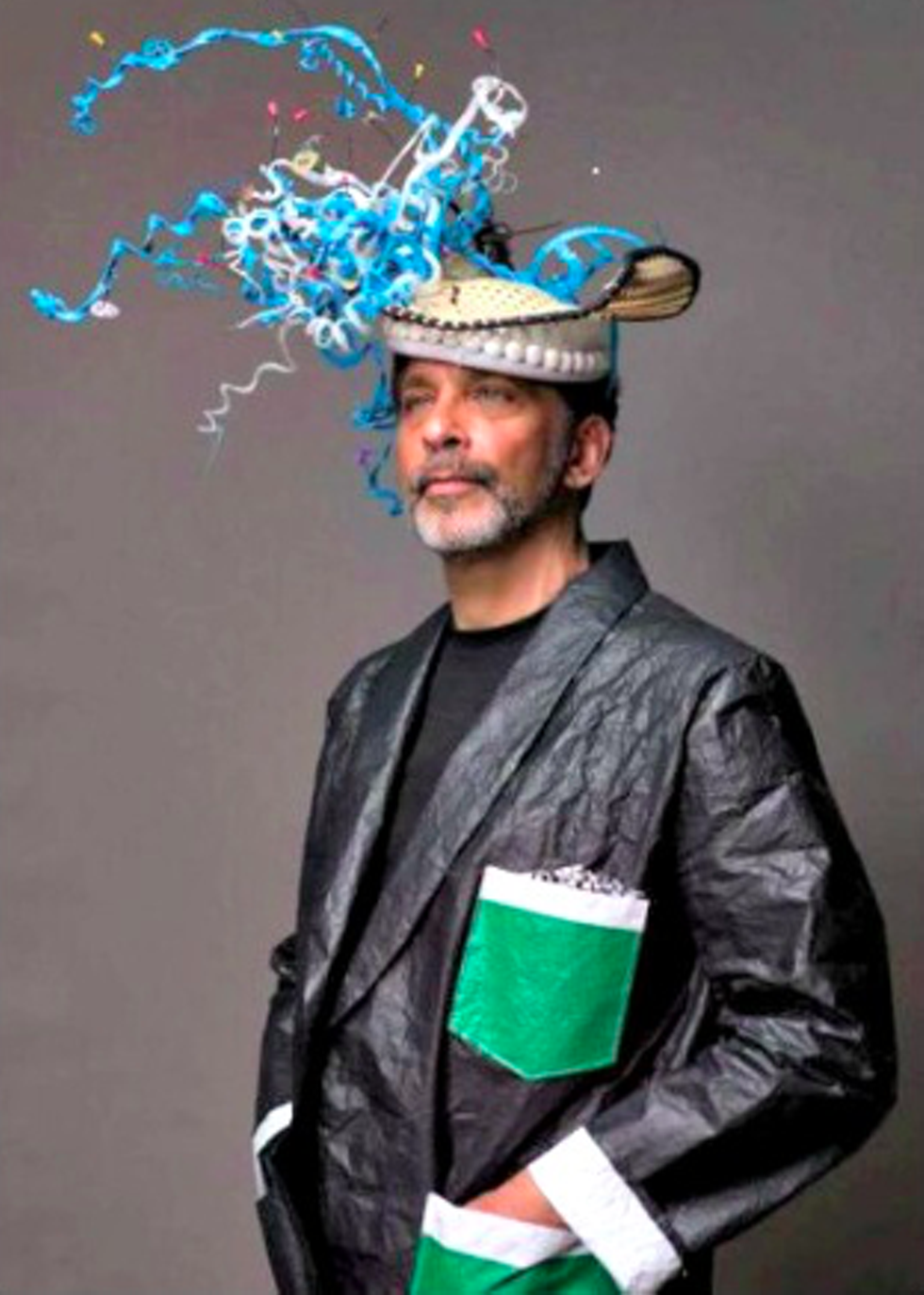Portrait of the artist with PLASTIC KANE HAT and Plastic Tarp Smokers Jacket &copy; Daniel Lanzilotta