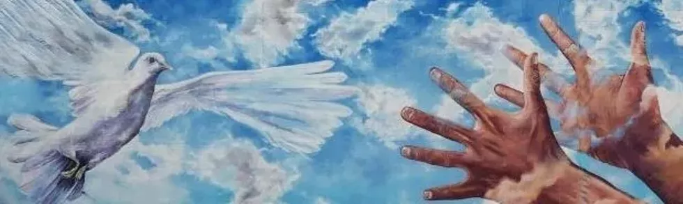 A mural of hands and doves in a parking lot