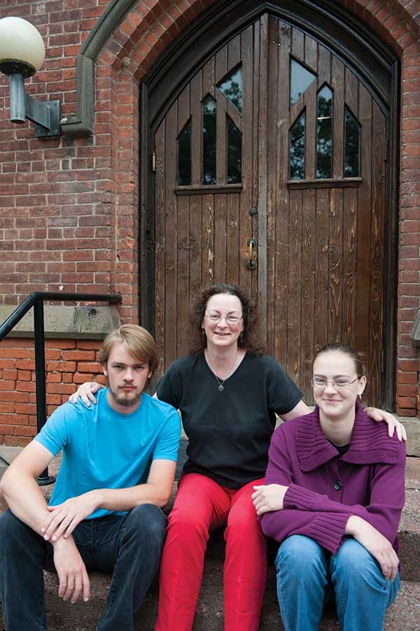 Homeschoolers Noah and Silvie Lundgren with their mother (and teacher) Deb.