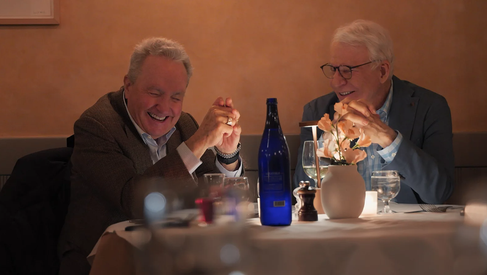 Lorne Michaels shares a laugh with Steve Martin.