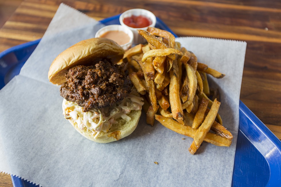 Chili burger with fries.