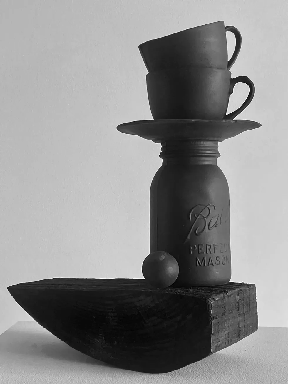 black totem 1, 2023 - black porcelain slip cast, wood, India ink, graphite wash 15 x 9 x 5 inches