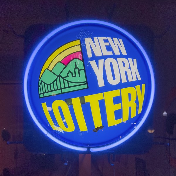 Neon sign, paper, packing tape, 18" diameter. 2024

This artwork features a neon sign for the "New York Lottery" with the letter "T" partially covered, transforming it to read "NY LOITERY." This change juxtaposes the concept of loitering—idleness and purposelessness—with the hopeful pursuit of fortune through the lottery, highlighting the contrast between ambition and inactivity.