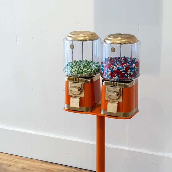 Gumball Machine, Gelatine Capsules, H:40.5” x W:15” x D:14”, 2024

This installation features a gumball machine filled with Prozac and other psychotropic pills instead of candy, offering a stark commentary on the state of American healthcare. It critiques the ease with which psychiatric medications are prescribed and the influence of pharmaceutical companies, highlighting the troubling reality behind seemingly benign treatments and the commodification of mental health.