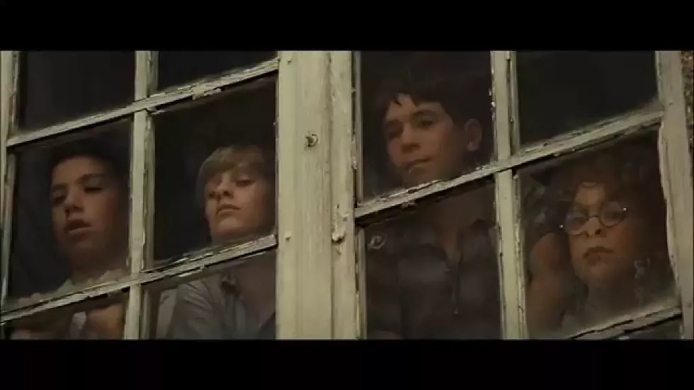 Students at a school for troubled boys look out a window in "The Chorus," a beautiful French film about healing, connection and second chances.