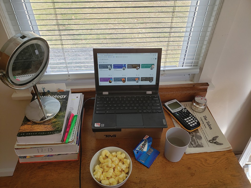 The author's set up for studying and club meetings. The computer is elevated on a shoebox and a makeup mirror enhances the lighting.