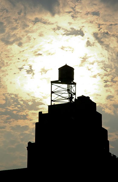 Water tower in silhouette, West 100th Street and Columbus Avenue, 2006.
