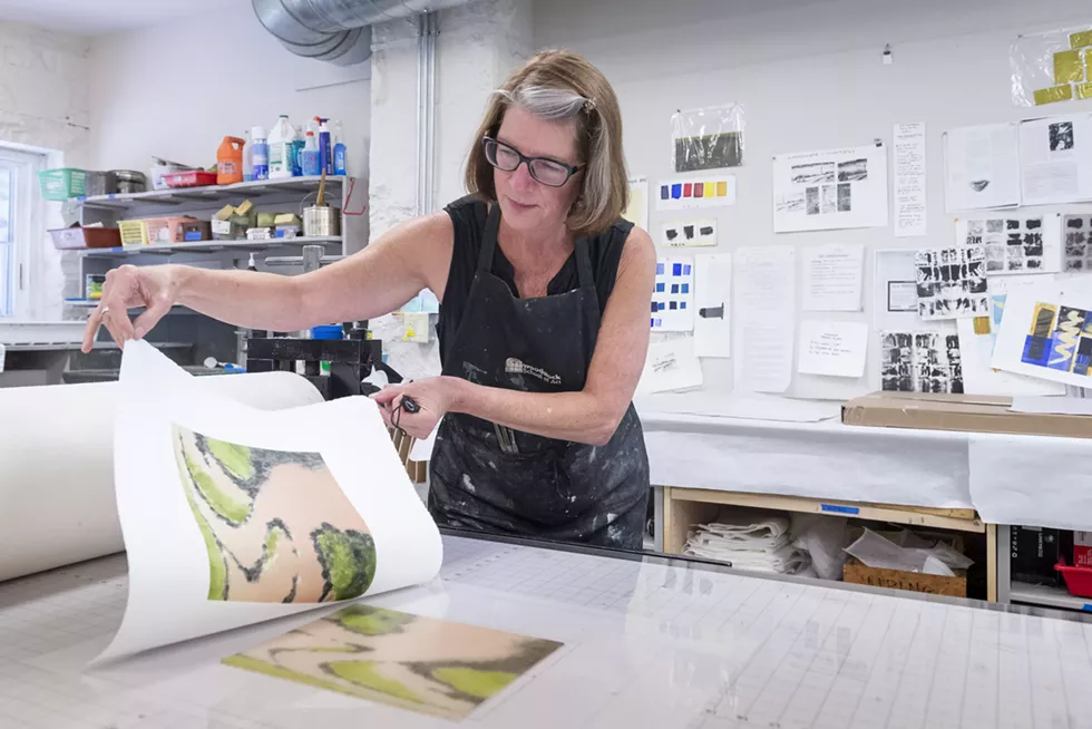 Artist Christie Scheele pulling a monoprint