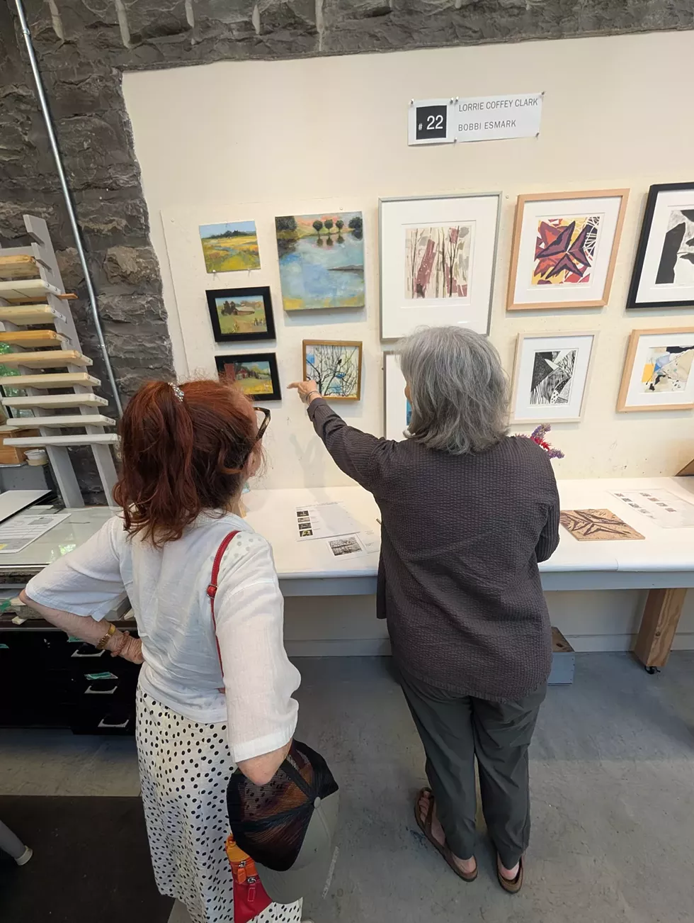 Print studio artist with customer