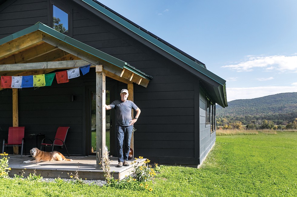 Writer David Noland on the porch of his Cornwall home. Despite no formal architectural training, Noland took up the challenge of the home’s zero- emission design himself, mastering Passive House standards and maximizing the layout for sunlight and exposure. “It’s not rocket science,” Noland explains of the home’s passive solar design. “The floors, walls and roof have to be well insulated and airtight. There needs to be proper air circulation and good windows with no thermal bridging. It’s really pretty simple.”